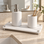 White — White stone vanity tray holding a soap pump and toothbrush cup on a bathroom vanity
