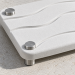 White — Close-up of the white stone vanity tray, rippled surface and stainless steel feet