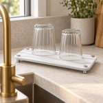 White — White stone vanity tray drying two glasses beside a kitchen sink
