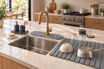 Wide view of a kitchen island with the full Trivelle Kitchen Ritual set arranged around the sink