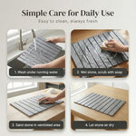 Four-step care guide for the stone bath mat: rinse, scrub with soap, sand lightly, and air-dry