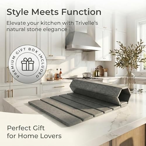Folded Trivelle stone drying mat standing upright on a white marble kitchen island
