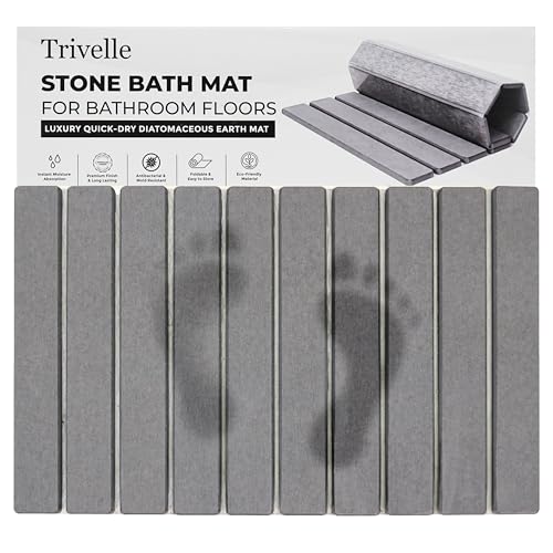 Trivelle stone bath mat with retail box — gray diatomite slats showing wet footprints fading as they dry
