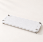 White — White stone sink caddy on a counter, raised on stainless steel legs