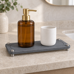 Dark Gray — Dark gray stone sink caddy with a soap pump and a stone cup on a counter
