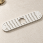 White — White stone faucet mat on a kitchen counter