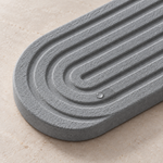 Dark Gray — Close-up of the dark gray stone faucet mat grooves with a water droplet