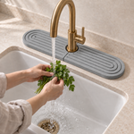 Dark Gray — Dark gray stone faucet mat behind the tap while herbs are rinsed