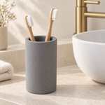 Dark Gray — Dark gray stone brush cup on a counter beside a basin
