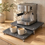 Stone Arc Riser Set as a coffee station with an espresso machine and two mugs of coffee