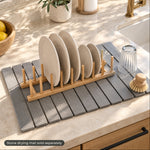 Bamboo plate rack on a stone drying mat by the kitchen sink, mat sold separately